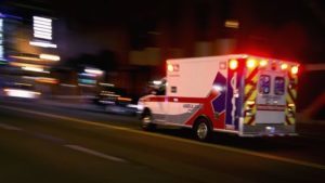 ambulance driving fast to a scene